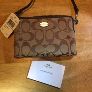 Coach wristlet with tags